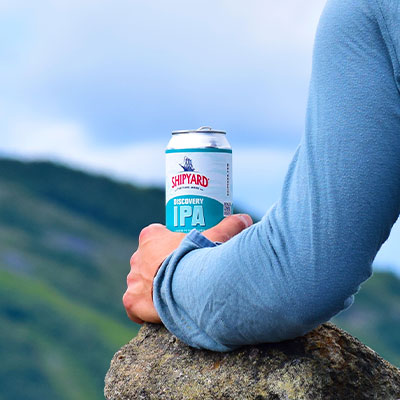 Shipyard Discovery IPA can on top of a mountain in Maine