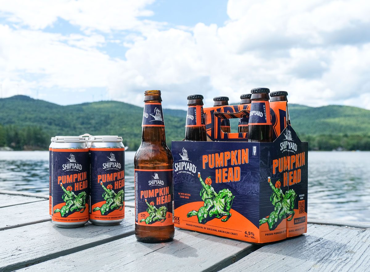 Pumpkinhead Ale Bottles and Cans on a lake dock in Maine